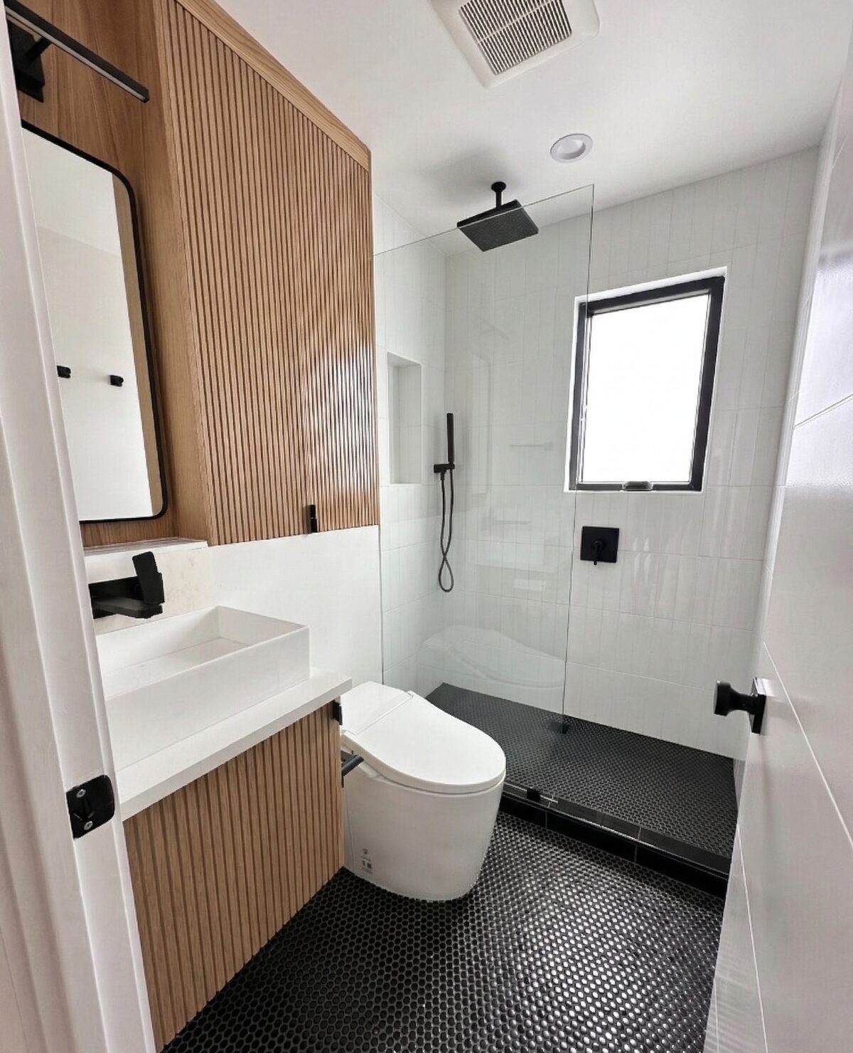 Custom white oak fluted bathroom vanity with linen cabinet — DodiHome