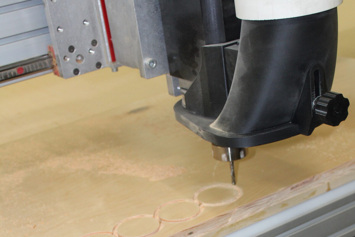 CNC machine cutting custom cabinet parts at DodiHome's Milpitas facility