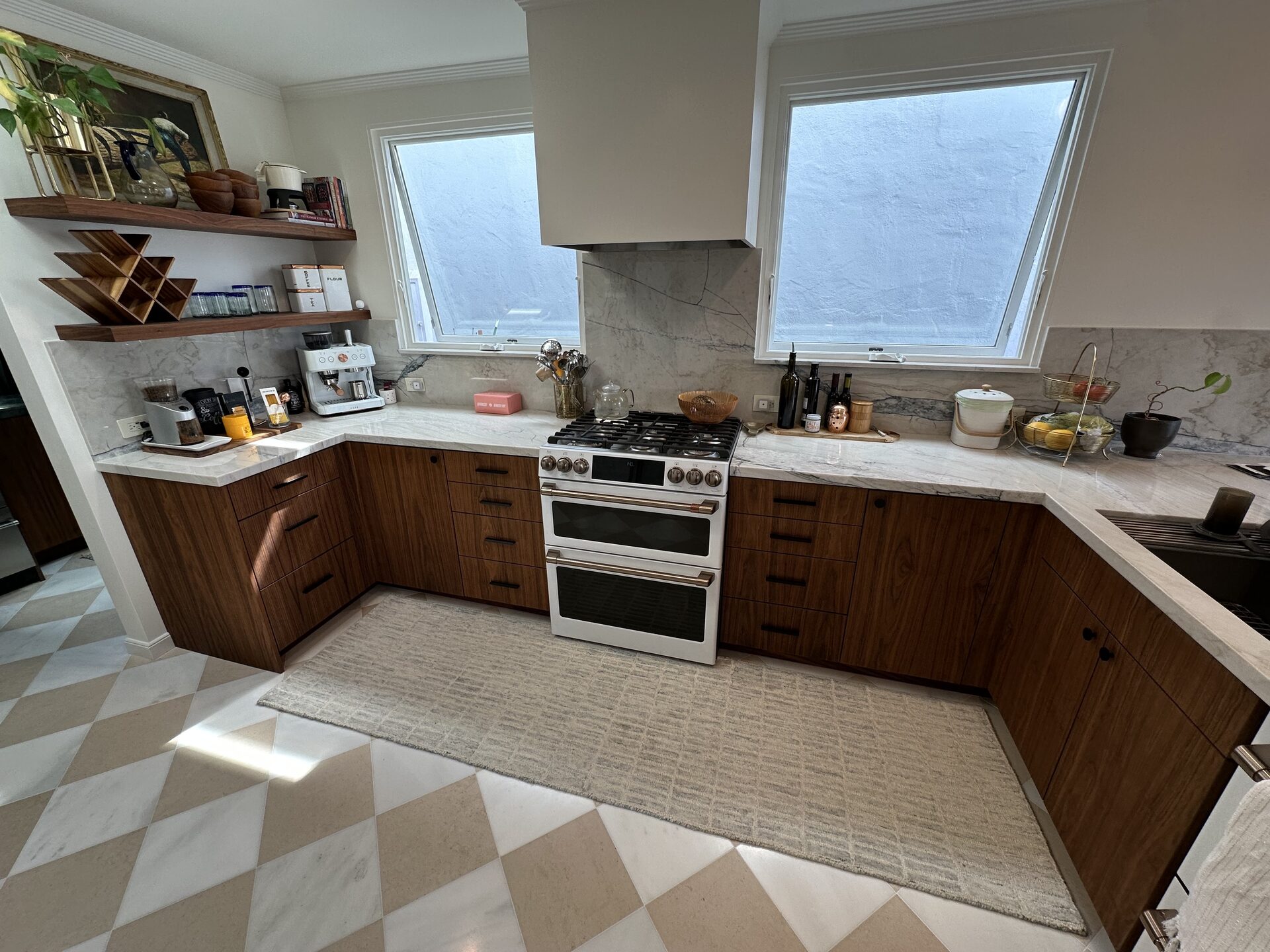 Walnut flat panel kitchen with peninsula and floating shelves — DodiHome