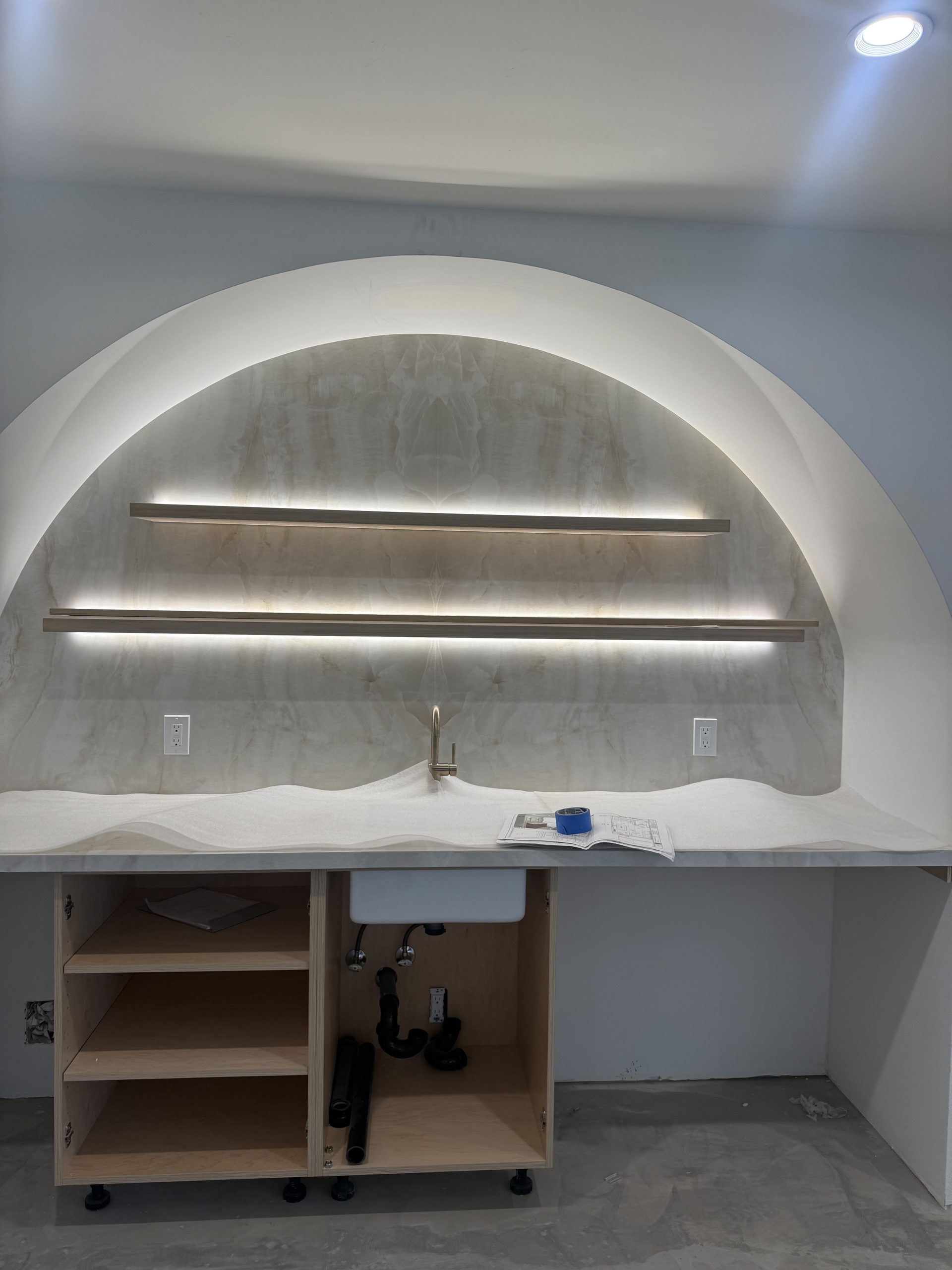 Primary finished-room view of custom wood wardrobe cabinetry and surrounding surfaces
