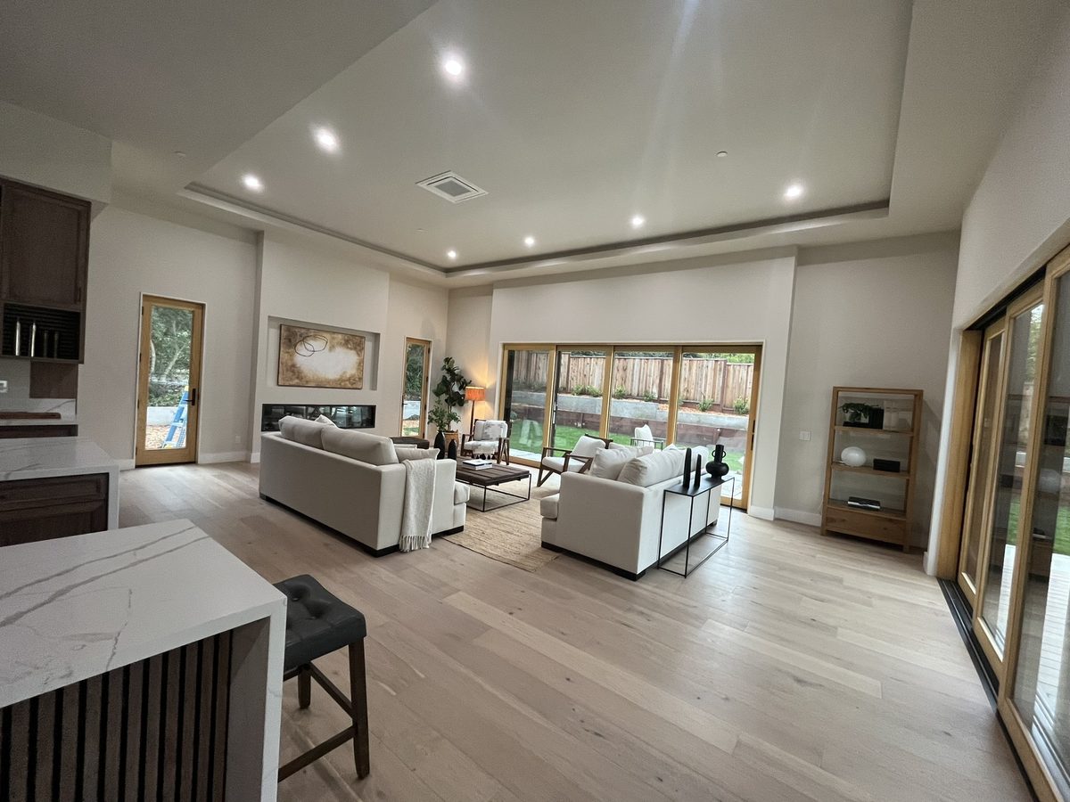 Third finished-room view of dark wood open-plan kitchen cabinetry and surrounding surfaces
