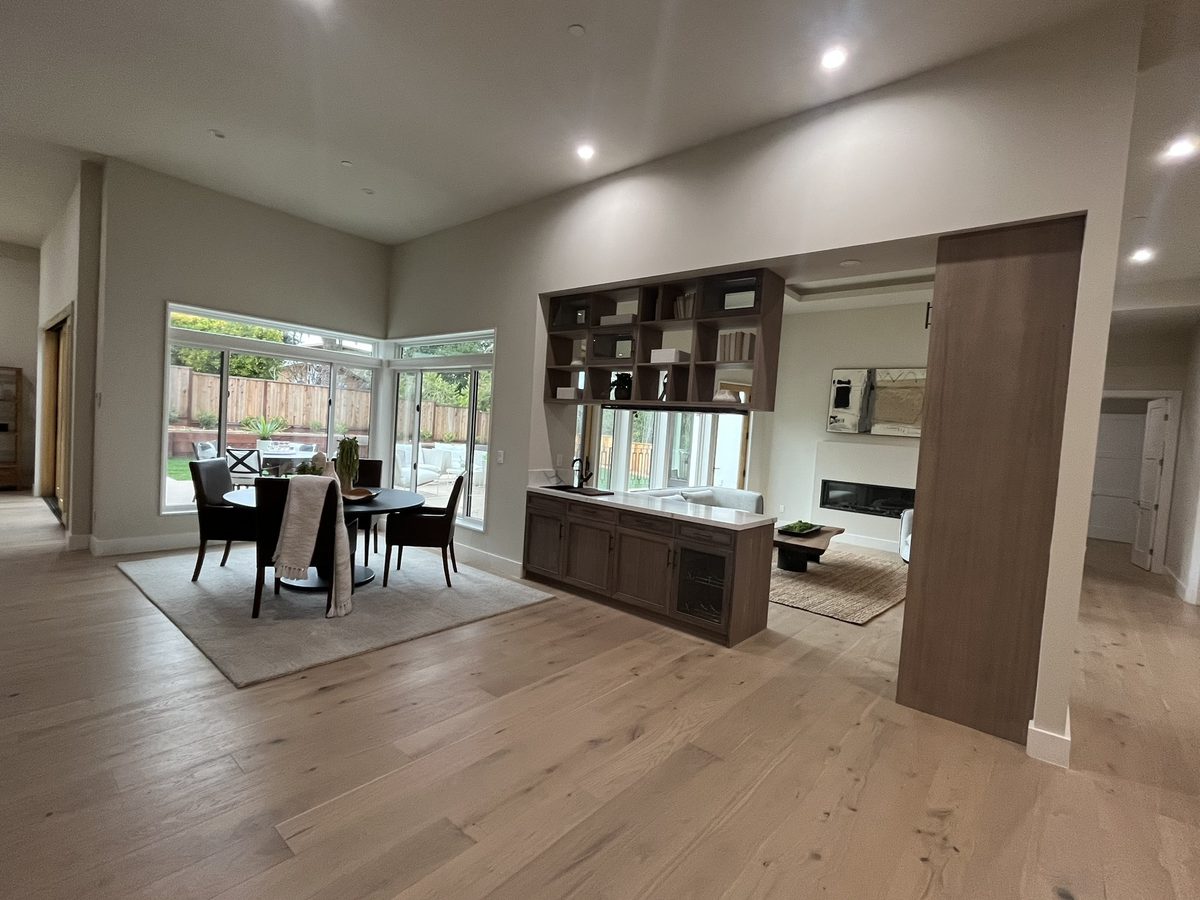 Fourth finished-room view of dark wood open-plan kitchen cabinetry and surrounding surfaces