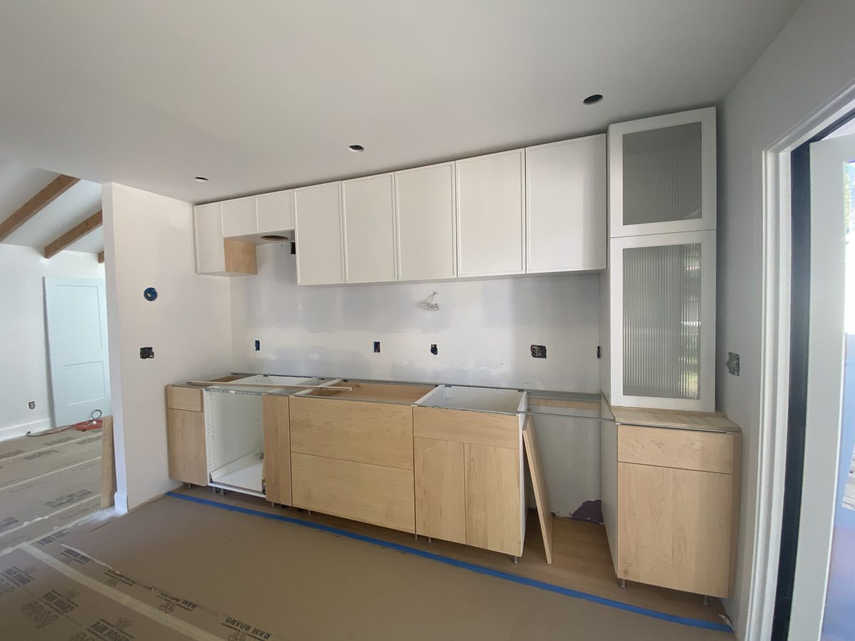 Primary finished-room view of light wood kitchen cabinetry and surrounding surfaces