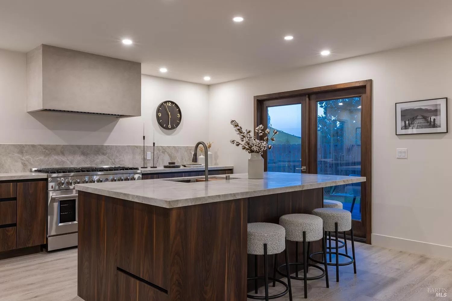 Primary finished-room view of walnut kitchen & vanity in napa cabinetry and surrounding surfaces
