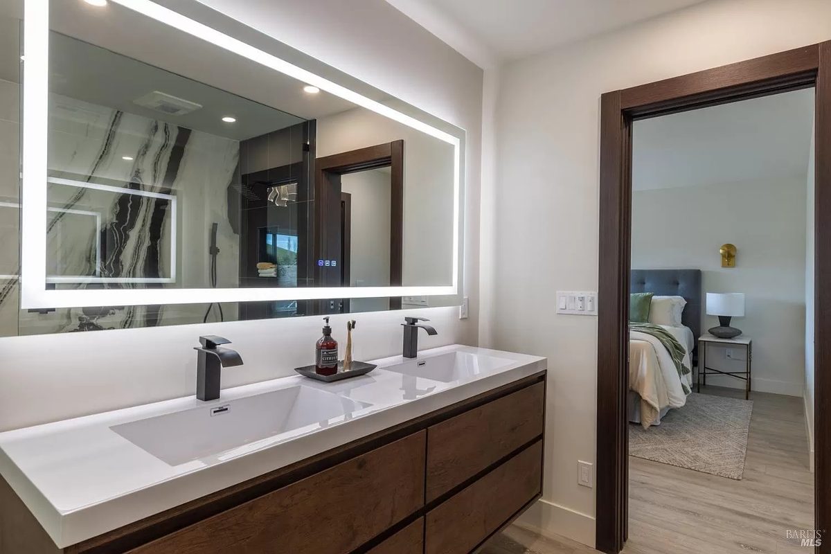 Seventh finished-room view of walnut kitchen & vanity in napa cabinetry and surrounding surfaces