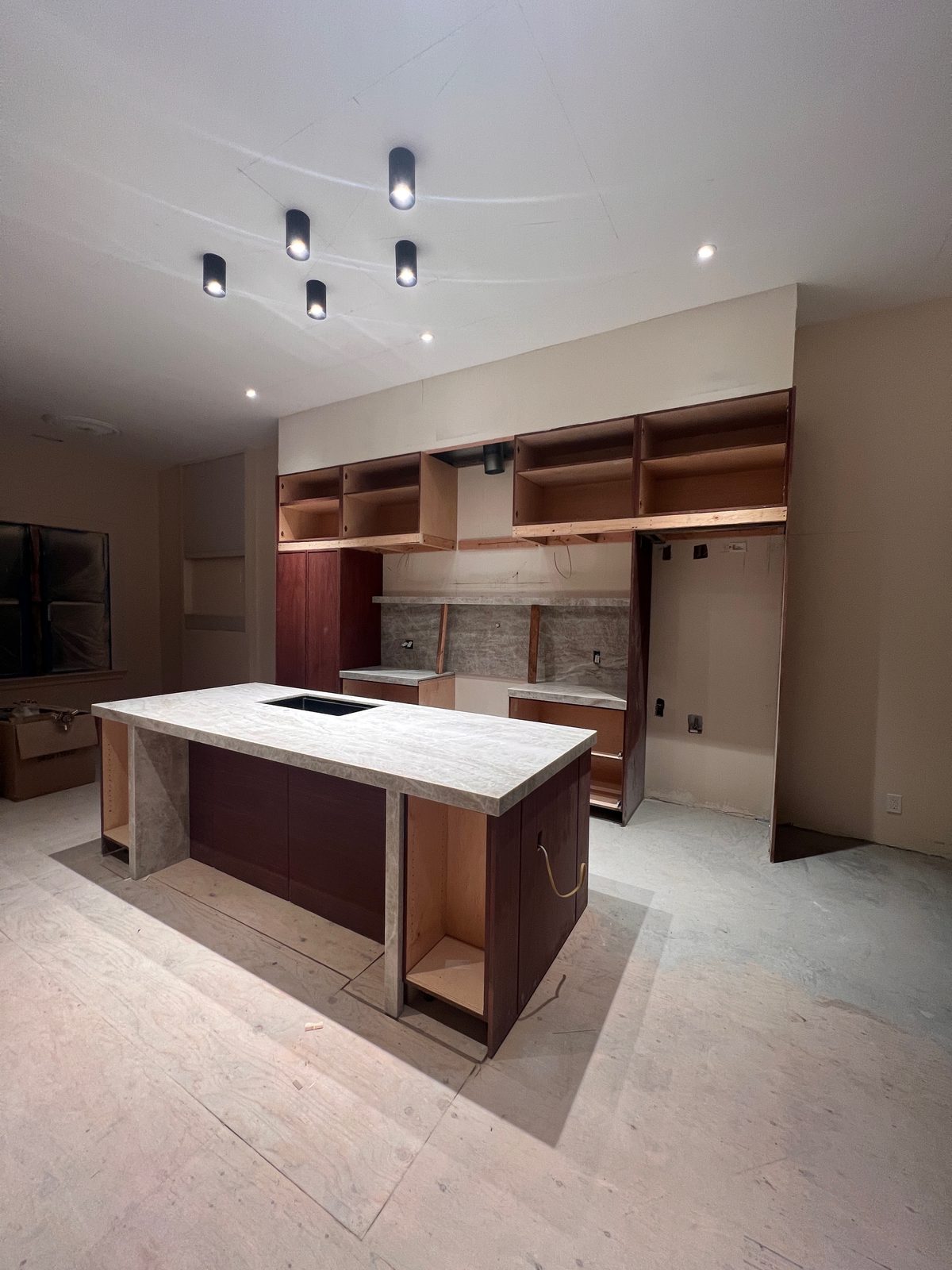 Third finished-room view of warm oak kitchen in oakland cabinetry and surrounding surfaces