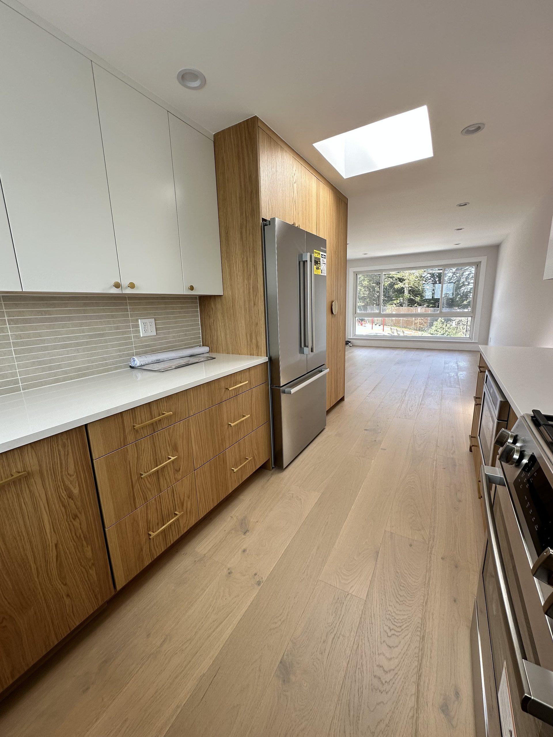 Primary finished-room view of light wood kitchen & bath in san francisco cabinetry and surrounding surfaces