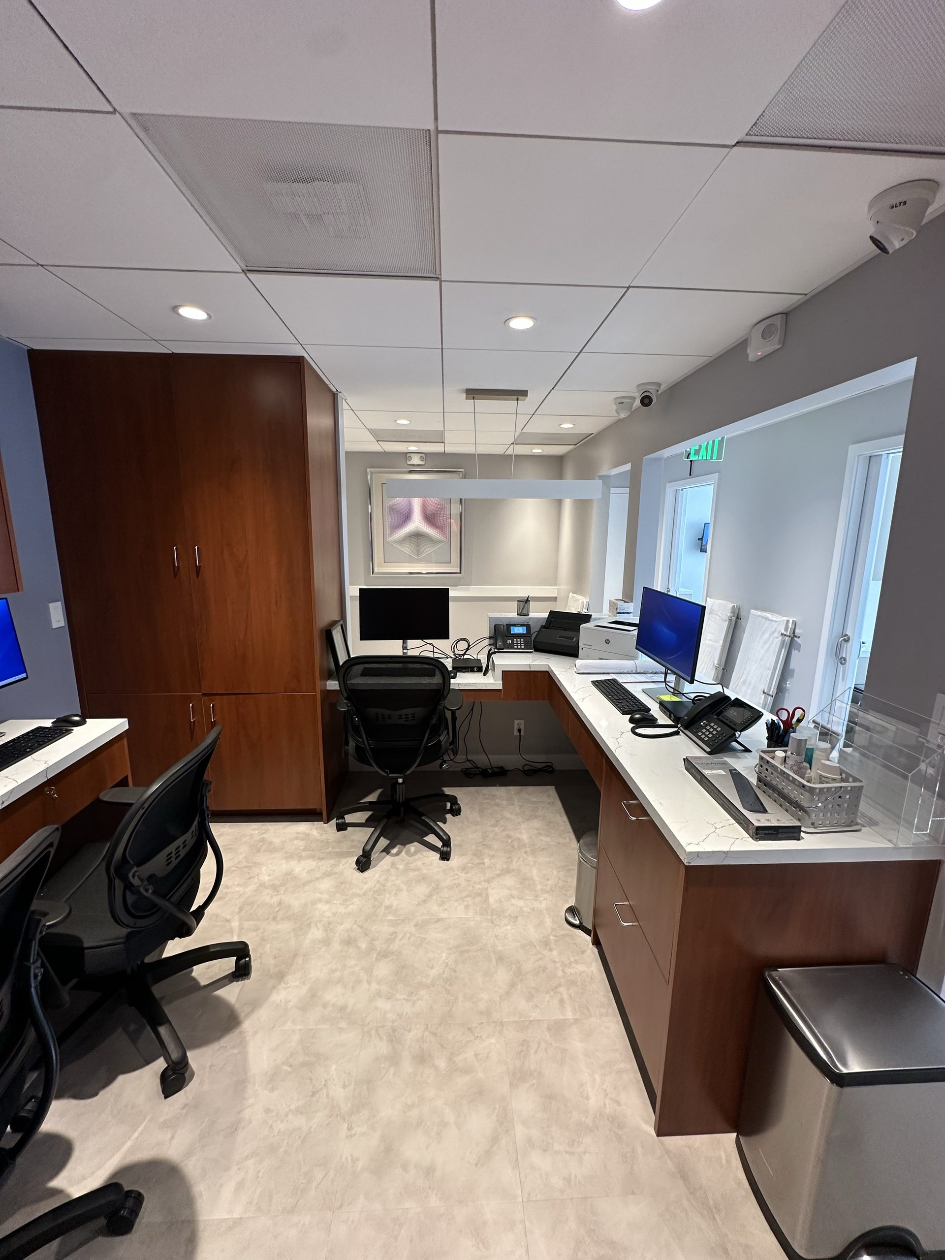 Primary finished-room view of walnut office cabinetry and an integrated workstation in San Francisco