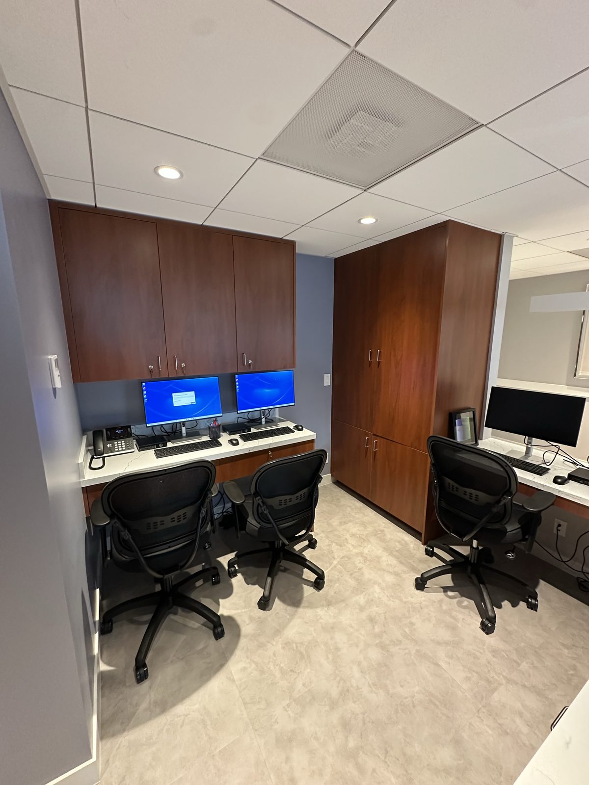 Third finished-room view of walnut office cabinetry and surrounding surfaces in San Francisco