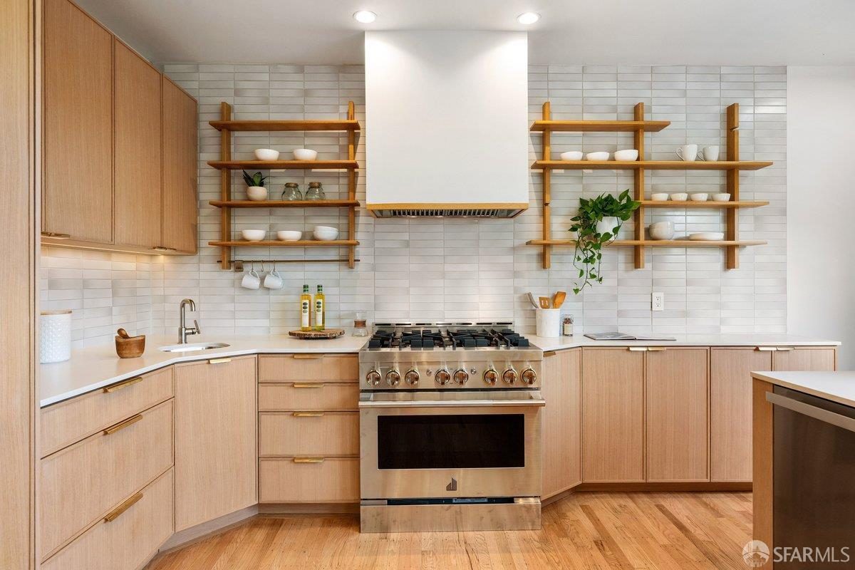 Primary finished-room view of warm wood island kitchen cabinetry and surrounding surfaces in San Francisco