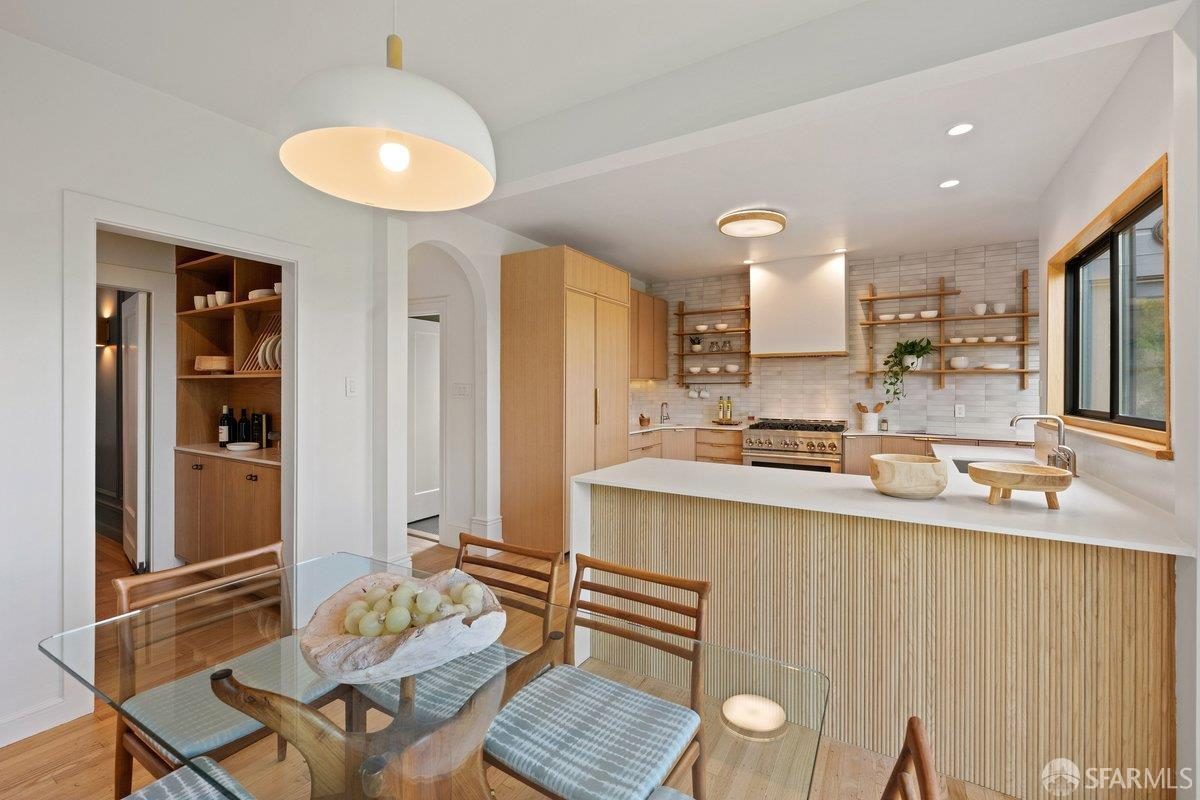 Third finished-room view of warm wood island kitchen cabinetry and surrounding surfaces in San Francisco