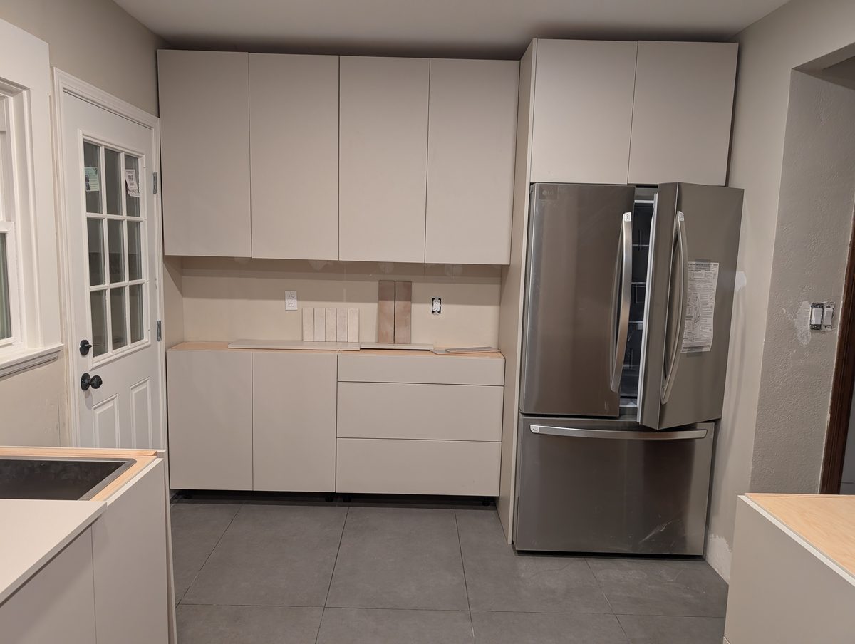 Primary finished-room view of soft gray flat-panel kitchen cabinetry and surrounding surfaces