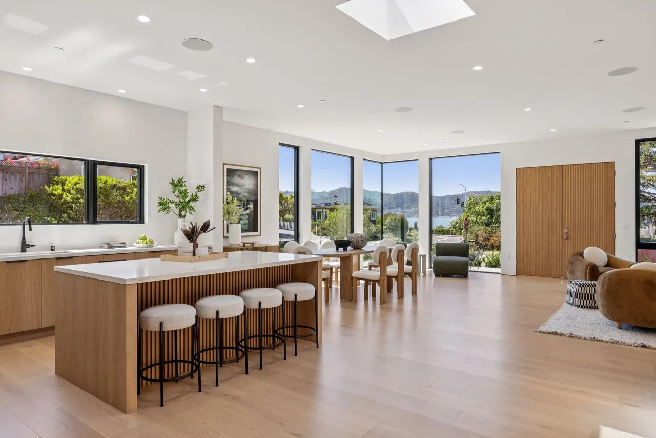 Primary finished-room view of light wood kitchen & laundry in tiburon cabinetry and surrounding surfaces