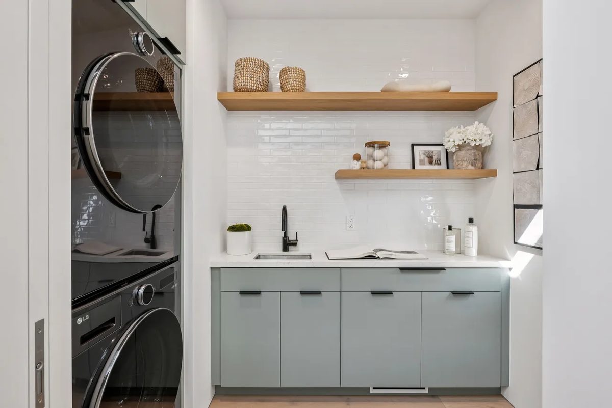 Sixth finished-room view of light wood kitchen & laundry in tiburon cabinetry and surrounding surfaces