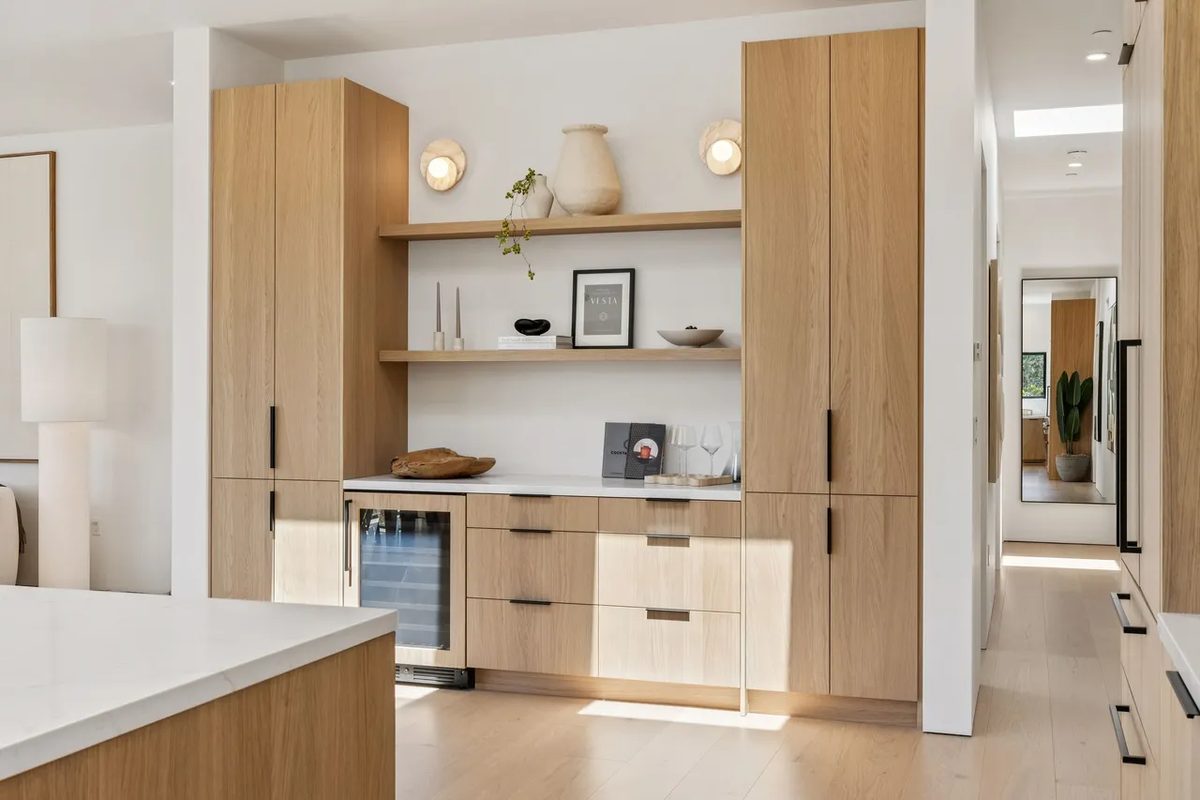 Eighth finished-room view of light wood kitchen & laundry in tiburon cabinetry and surrounding surfaces