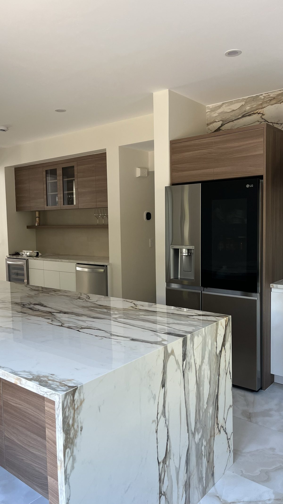 Second finished-room view of two-tone kitchen & built-ins cabinetry and surrounding surfaces