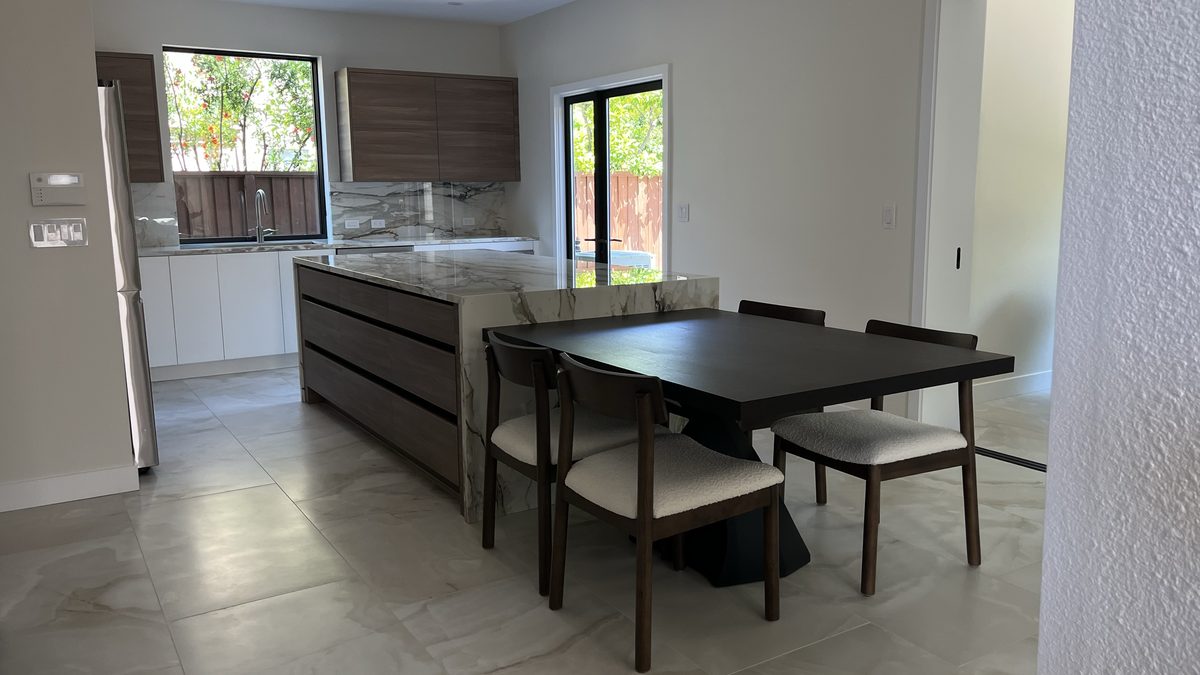 Fourth finished-room view of two-tone kitchen & built-ins cabinetry and surrounding surfaces