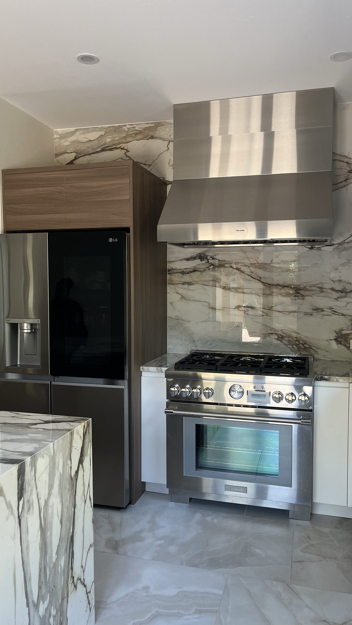 Fifth finished-room view of two-tone kitchen & built-ins cabinetry and surrounding surfaces