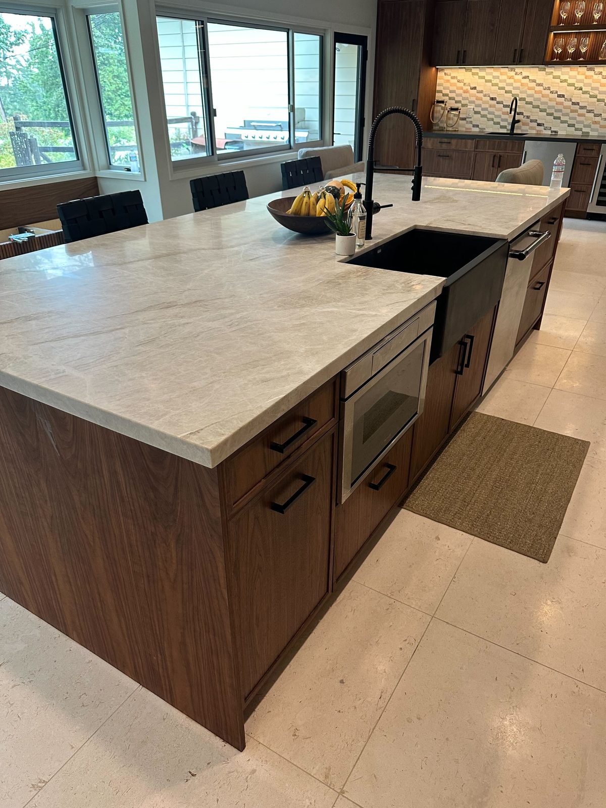 Third finished-room view of walnut kitchen, bar & home office cabinetry and surrounding surfaces