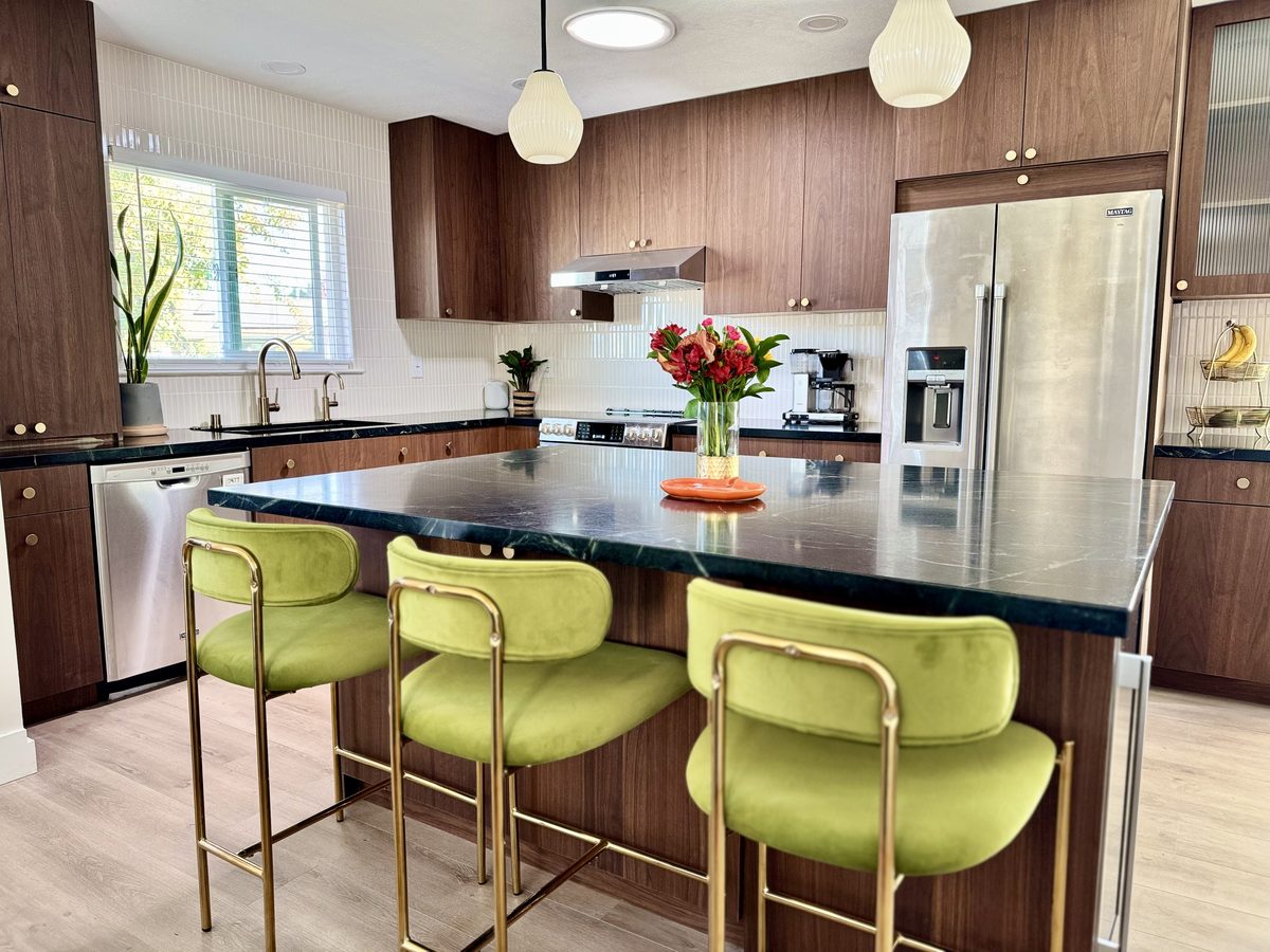 Primary finished-room view of walnut kitchen with green accents cabinetry and surrounding surfaces