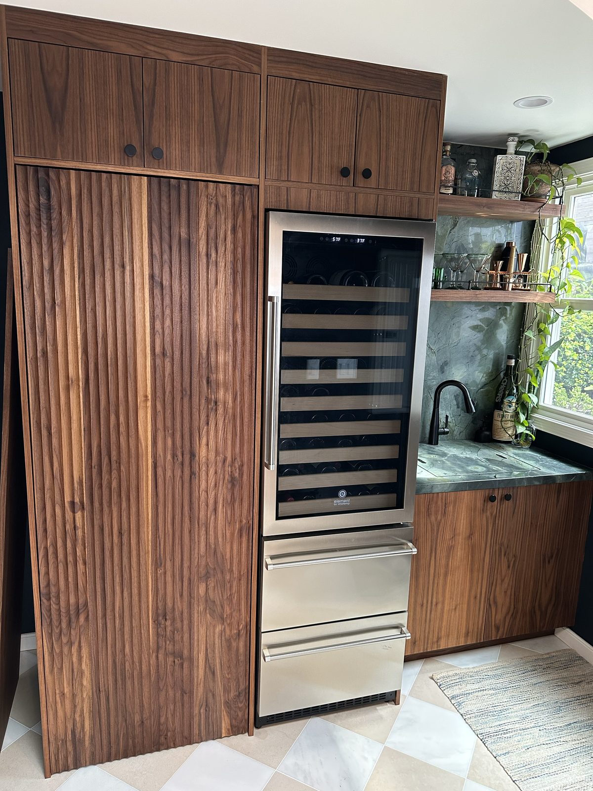 Fifth finished-room view of walnut kitchen & tall storage cabinetry and surrounding surfaces